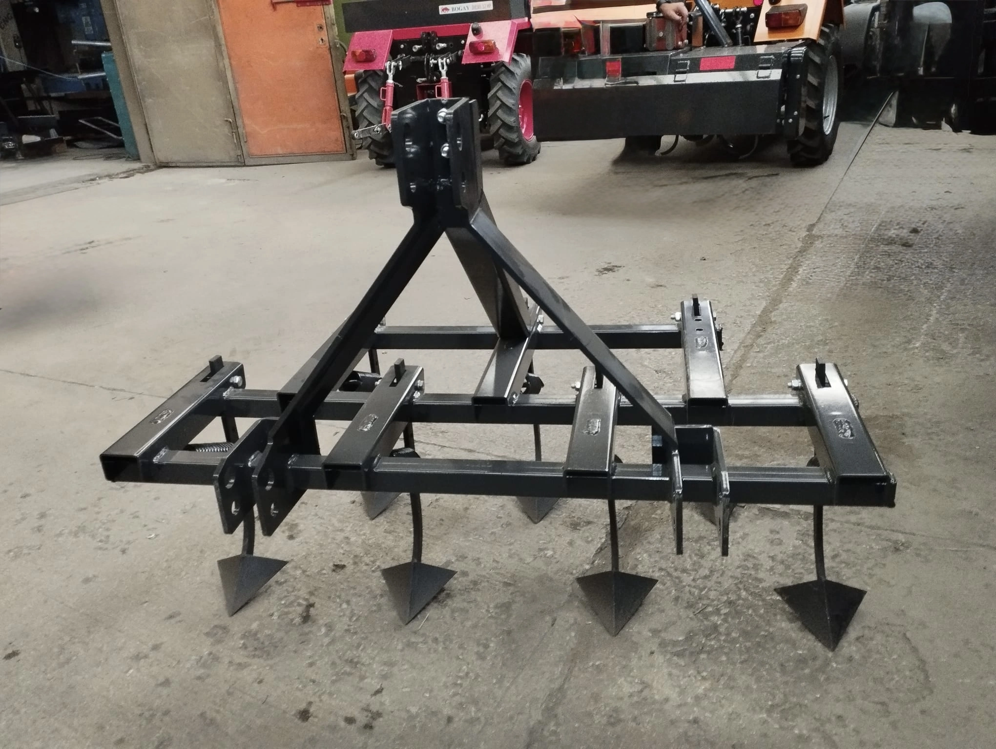 Spring crowbar cultivator attachment